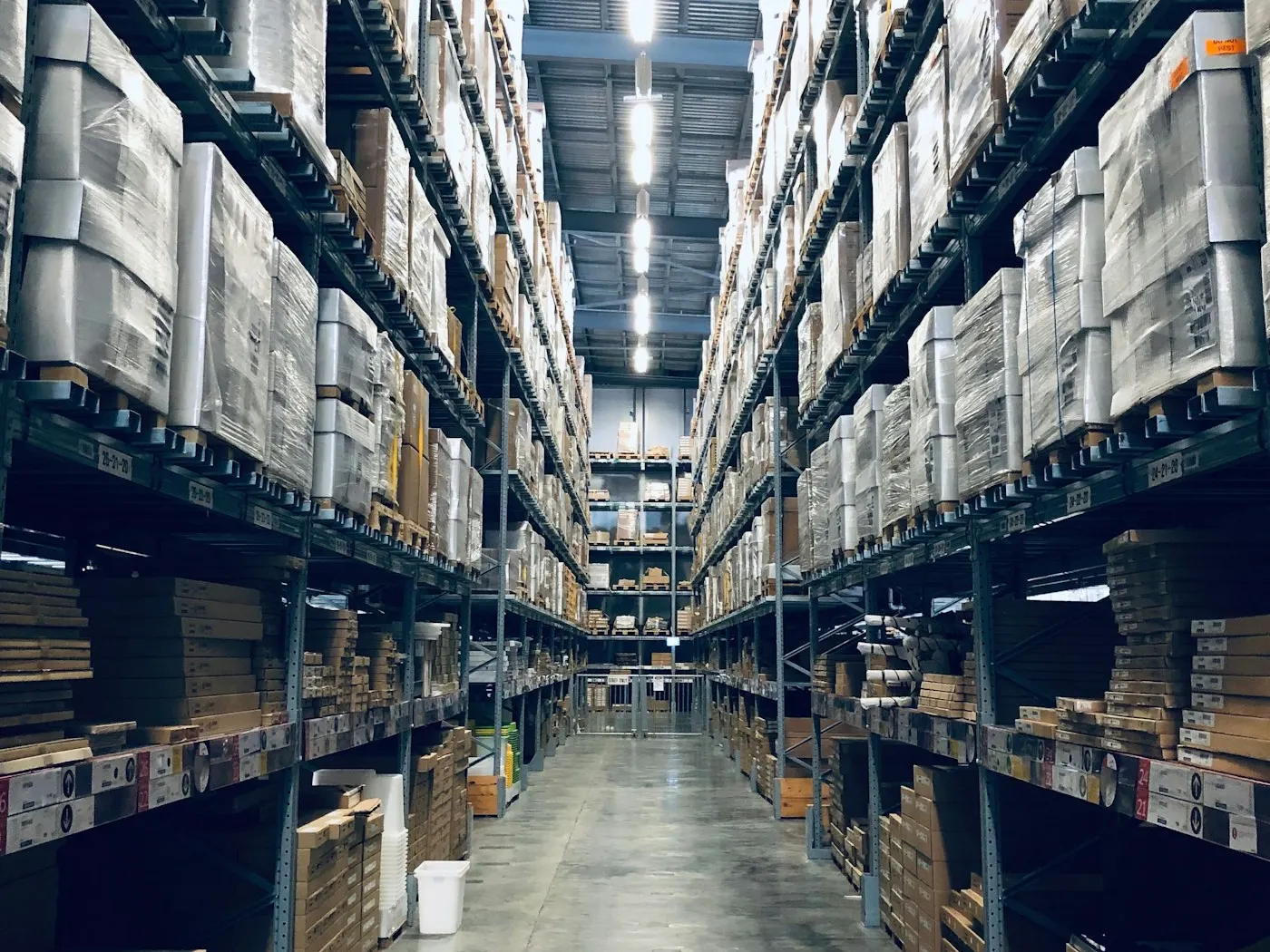 Racked UAE distribution warehouse aisle stocked with palletised it & electronics